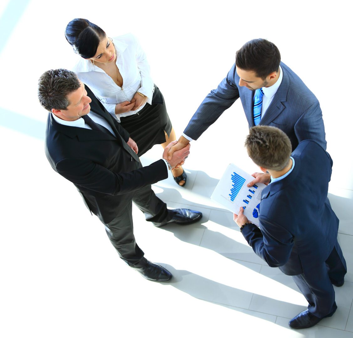 Top view of a successful business leaders finalizing a deal at office
