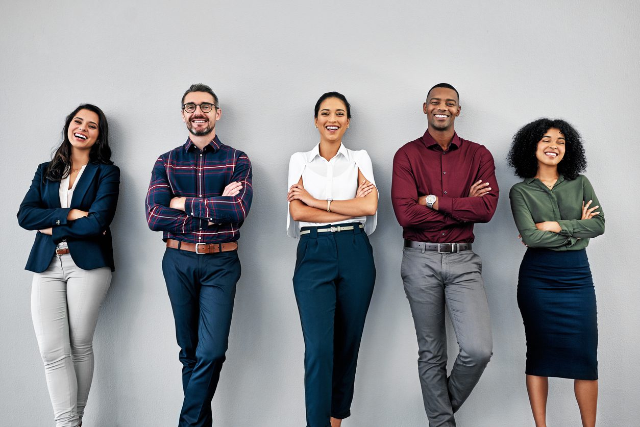 We put the human in human resources Studio shot of a group of businesspeople standing in line against a grey background