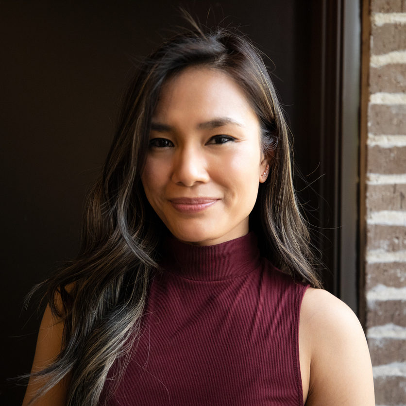Portrait of confident woman smiling at the camera.